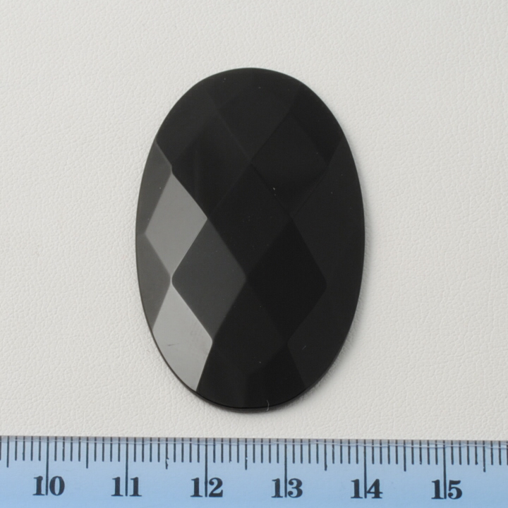 BLACK ONIX FACETED OVAL CAB 30X50MM